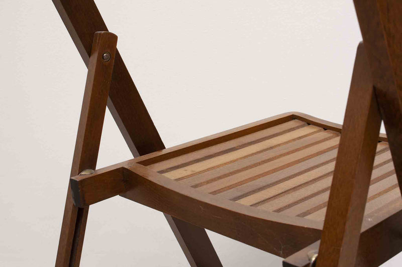 Vintage folding wooden chair with half-moon seat